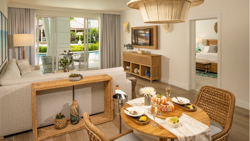 West Bay One Bedroom Swim-Up Butler Suite with Patio Tranquillity Soaking Tub Living Room